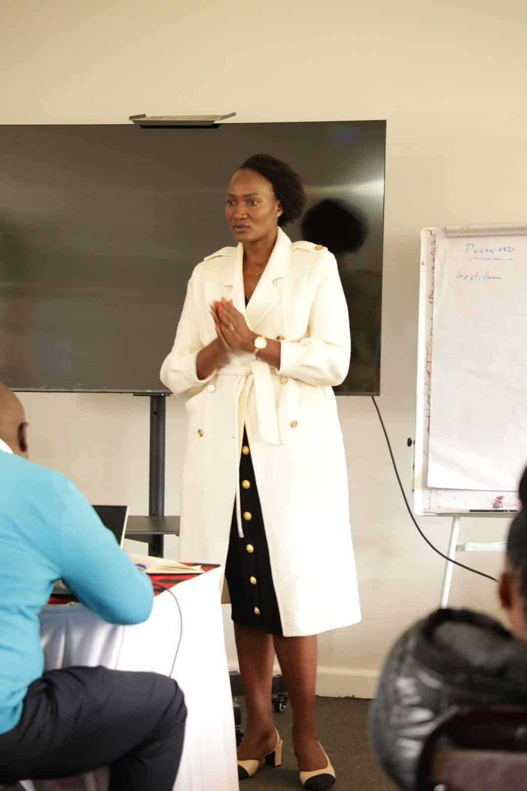 Women giving a presentation in a classroom setting.