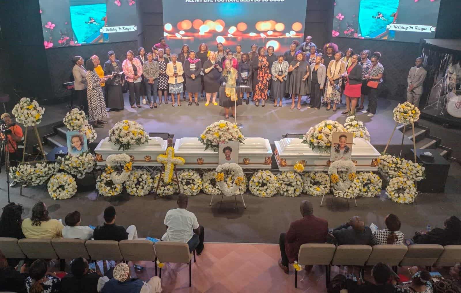 Funeral service honoring loved ones with floral arrangements and family gathering.