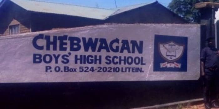 Chebwagan Boys High School signboard in Littein, Kenya.