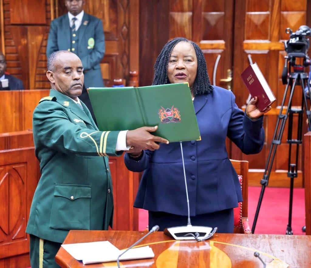 Kenyan officials during swearing-in ceremony in a courtroom setting.