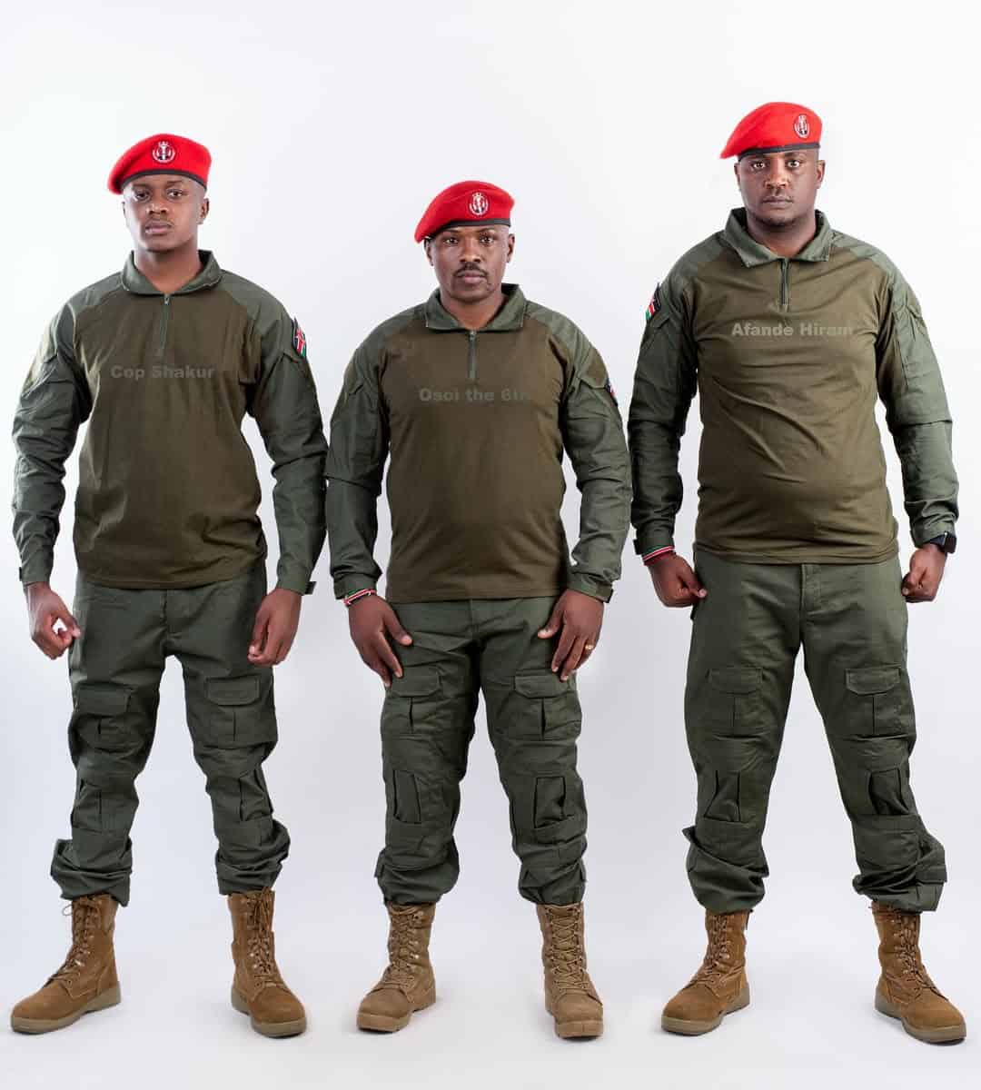 Military personnel in uniform with red berets standing confidently.