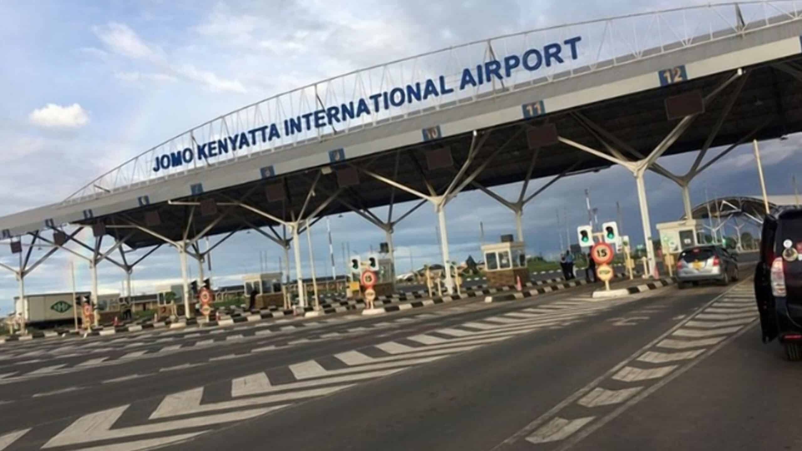 Jomo Kenyatta International Airport sign and entrance area in Nairobi, Kenya.
