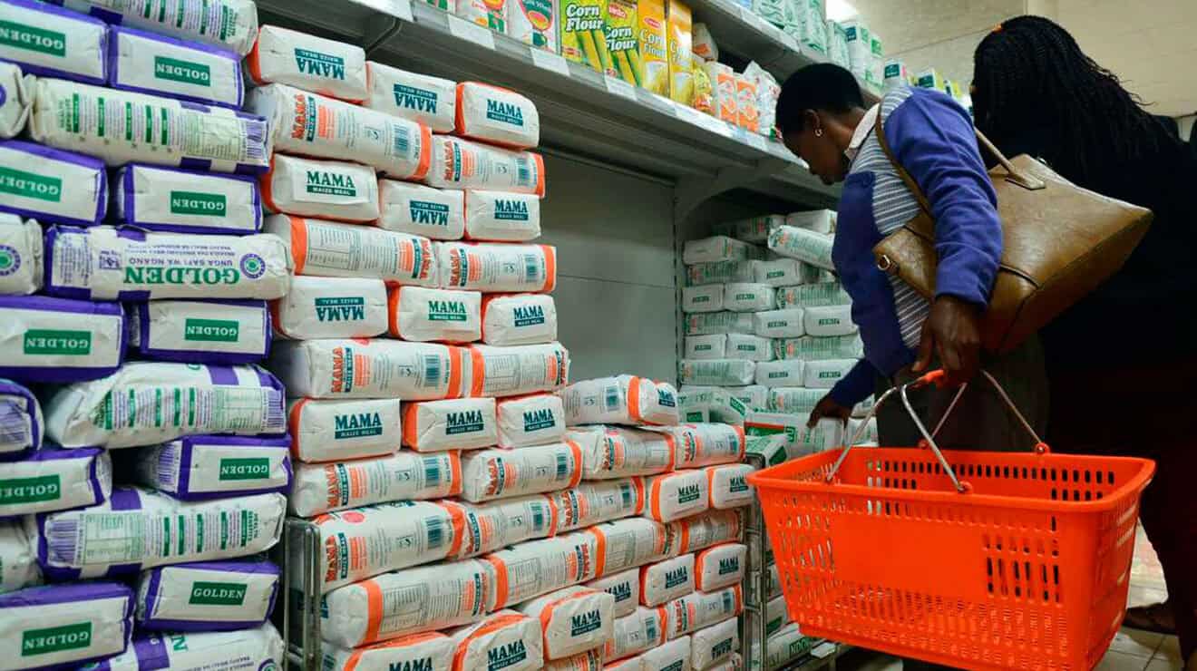 Shoppers selecting baby diapers at Kwetu Collections store.