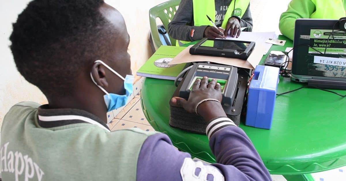 Young woman using a mobile card reader for digital payments.
