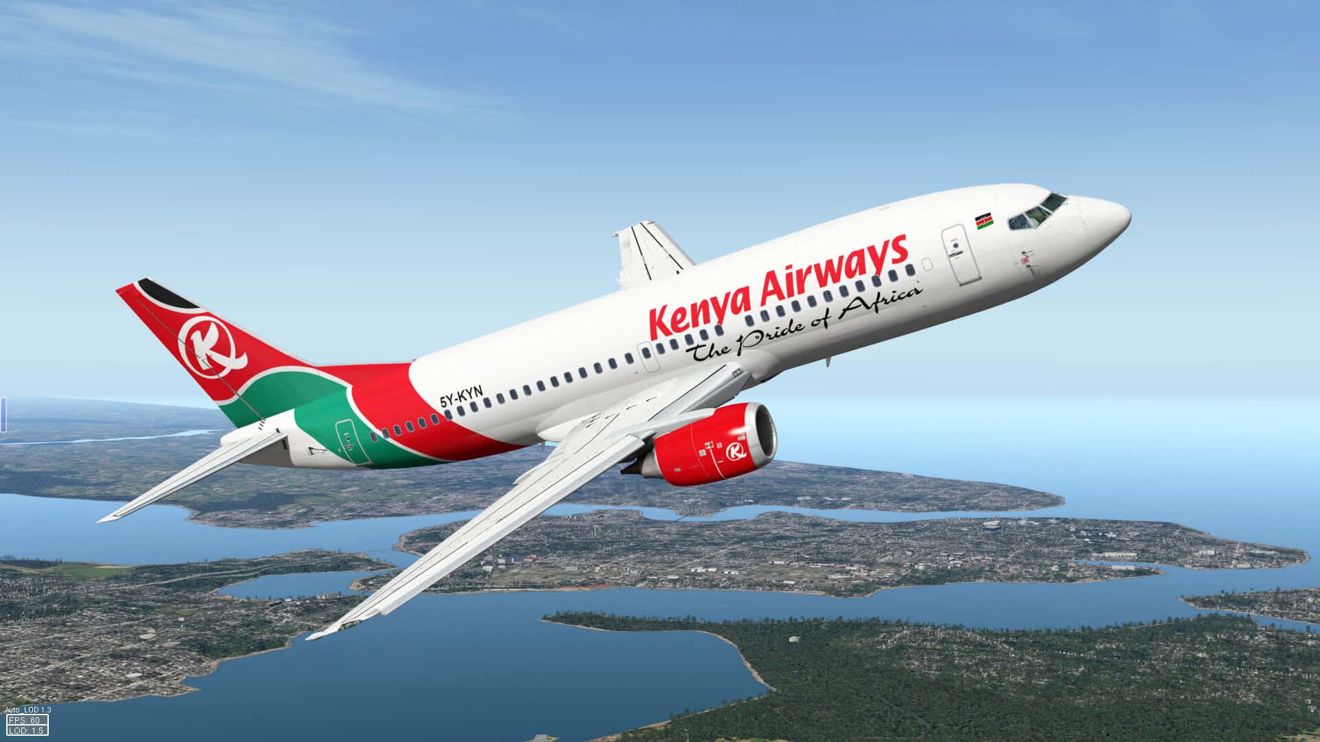 Kenya Airways airplane soaring over lakes and landscape in Kenya.